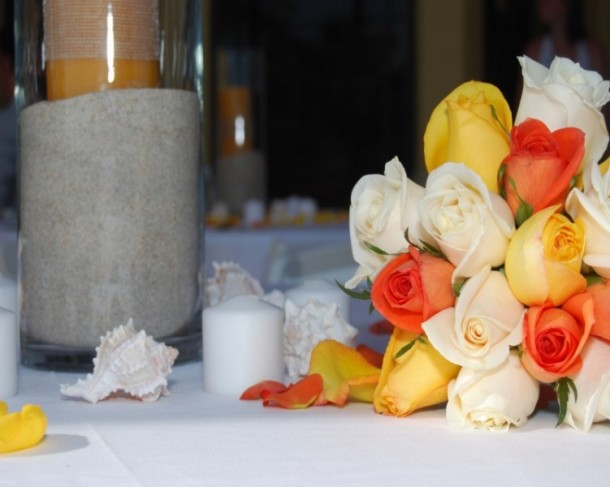 This wedding photo shows the bridal bouquet used at a beach wedding ceremony