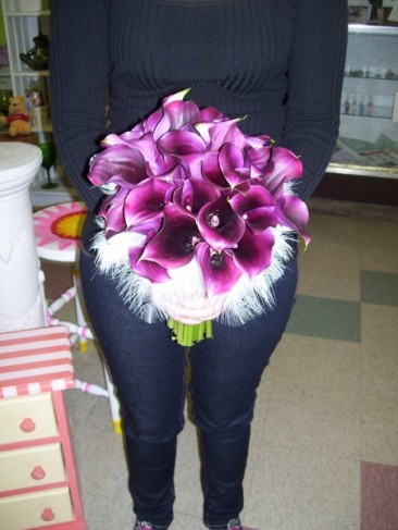 This beautiful bridal bouquet is created with gorgeous purple cala lilies 