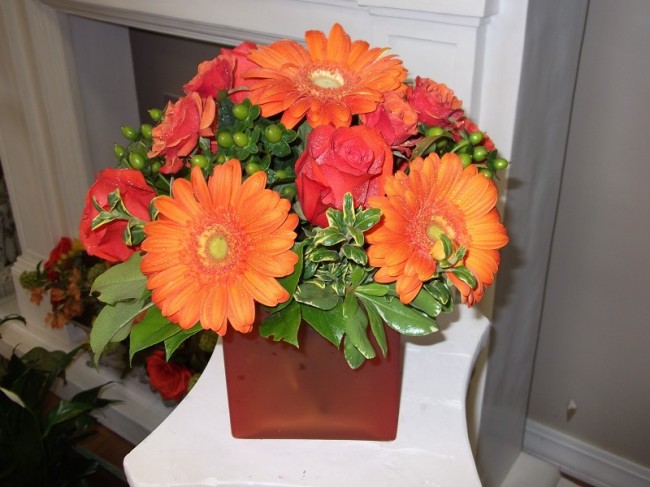 This floral centerpiece would make the perfect accent for a fall wedding 