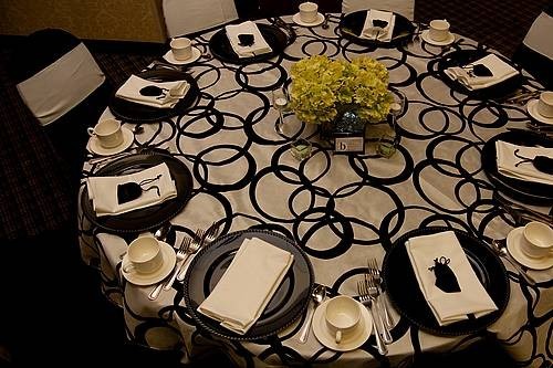 This unique wedding reception table features metro fabric that is very 