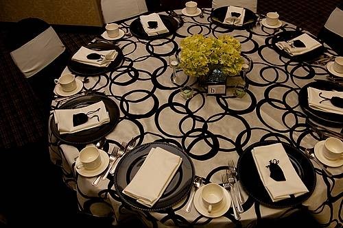 This unique wedding reception table features metro fabric that is very