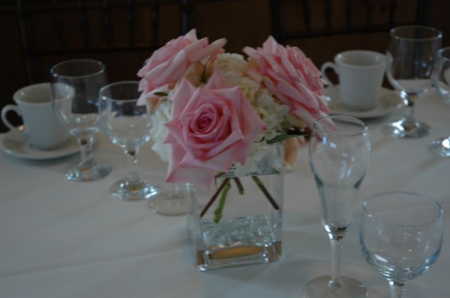 A beautiful rose and hydrangea wedding reception centerpiece would look 