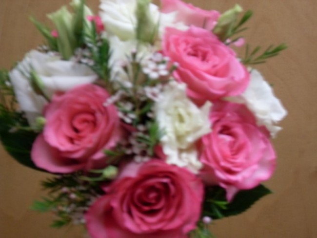 This beautiful wedding bouquet features beautiful pink roses and white 