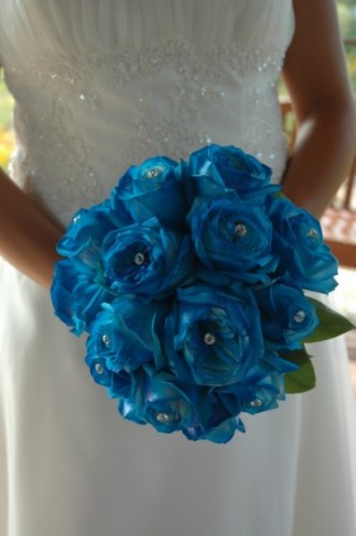 This gorgeous blue bridal bouquet was created with blue roses