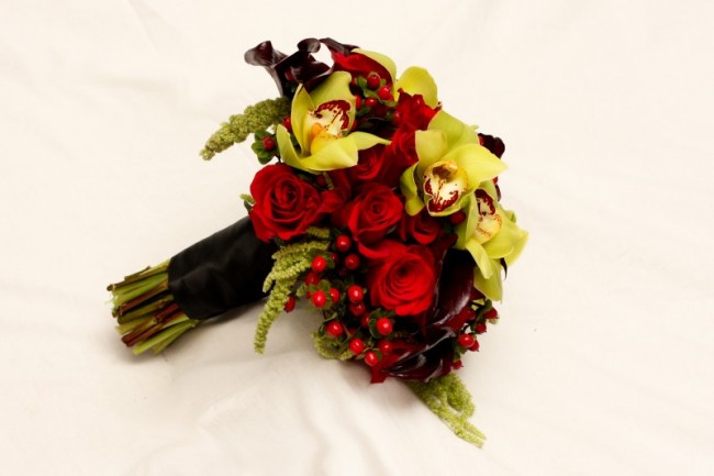This beautiful red rose wedding bouquet features beautiful green flowers as 