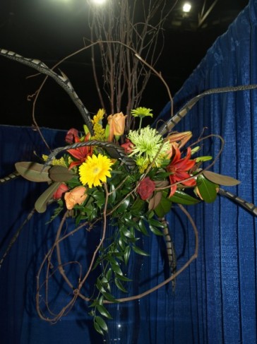 This gorgeous rustic wedding bouquet features yellow red and green flowers