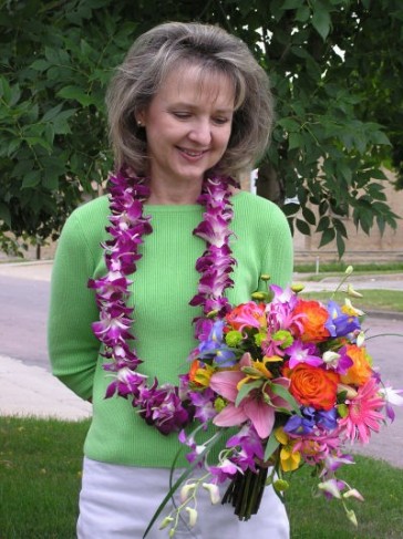 This tropical bridal bouquet was created with purple dendrobian orchids with