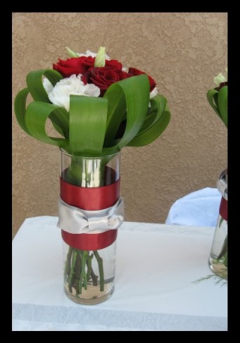 These beautiful reception centerpieces were created with red and white roses