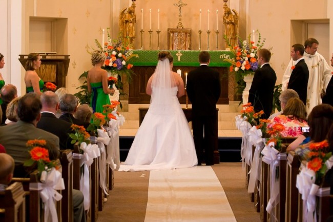 This beautiful wedding ceremony is adorned with gorgeous orange wedding 