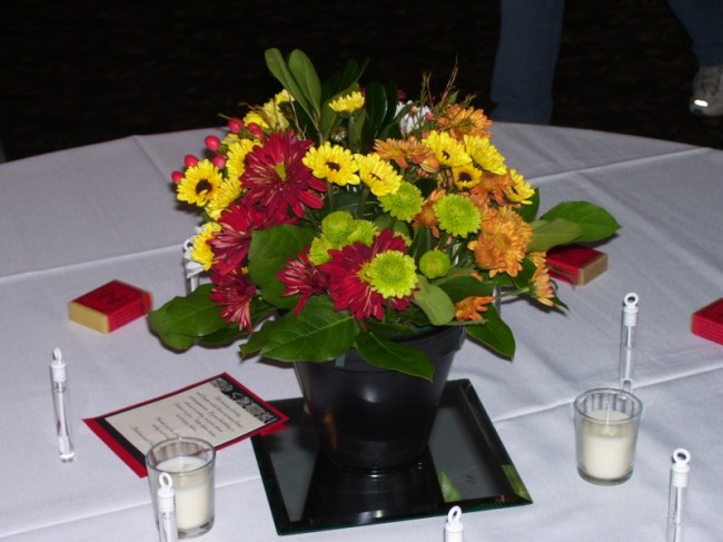 wedding reception centerpiece is featured on a Pedestal with Fall colors