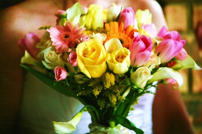 This beautiful wedding bouquet features all the colors and flowers of spring