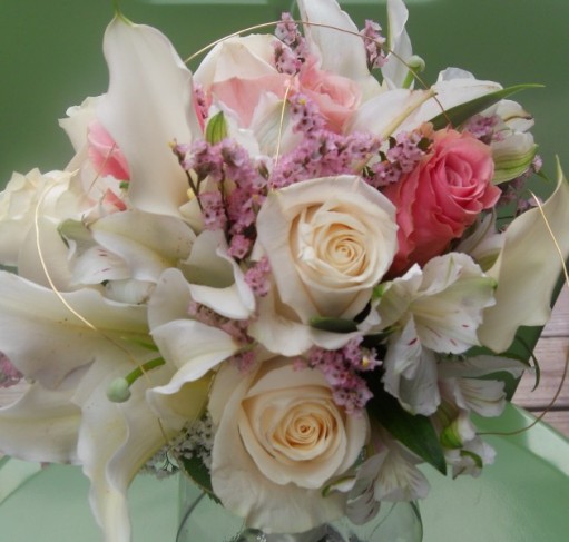 This gorgeous spring bridal bouquet features White Oriental Lilies 