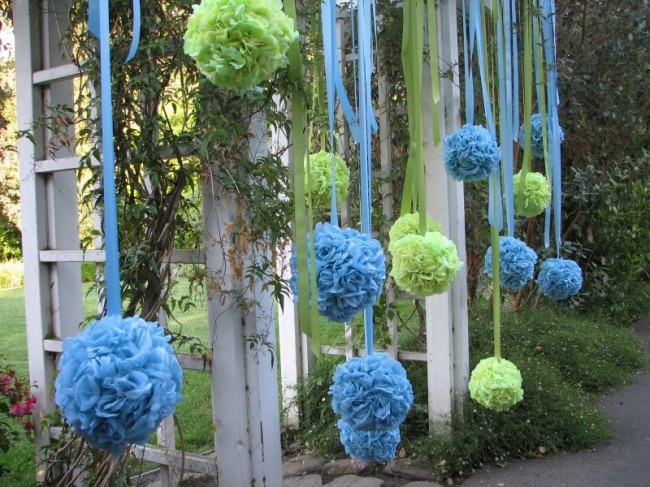 These beautiful wedding decorations feature green and blue kissing balls or