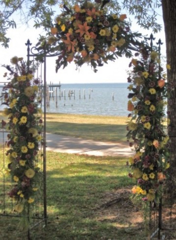 This gorgeous arch is decorated with beautiful wedding flowers and great for