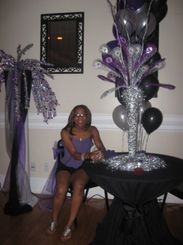 The purple and silver party centerpieces look amazing