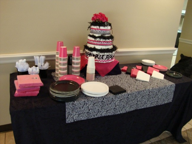 This table has gorgeous black linens with a table runner and an adorable 