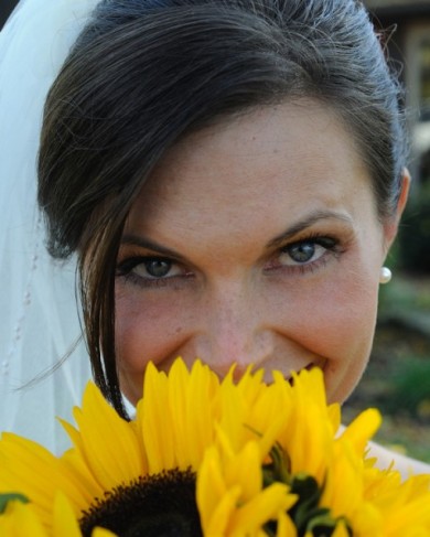 This wedding photographer captures this gorgeous bride hiding behind some 