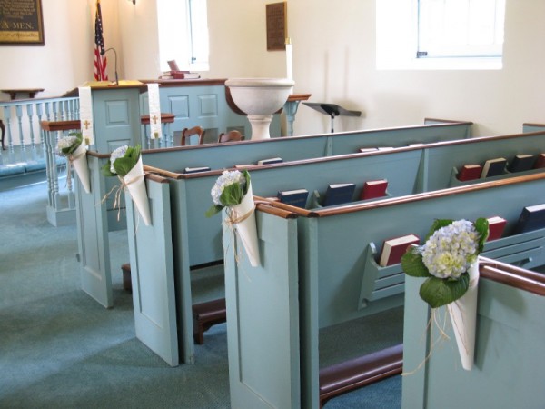 Pew cones with blue hydrangea in a Colonial Church makes for beautiful 