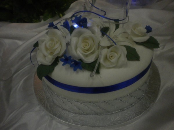 Silver White and Blue Wedding Cake Share