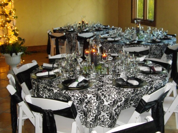 This gorgeous wedding reception has beautiful black and white damask print 