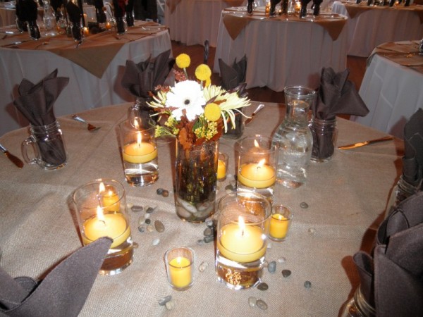 This fall wedding features beautiful fall colored reception centerpiece