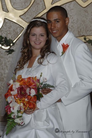  just a young couple in a jacketed wedding gown and allwhite tuxedo