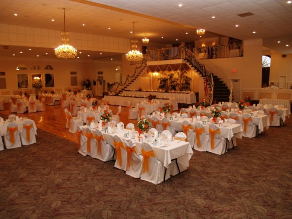  orange and white wedding reception with beautiful centerpieces and decor 