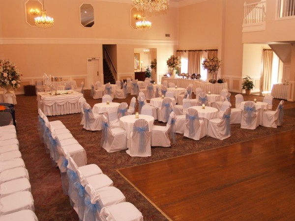  with the white table linens accented with the blue chair sashes