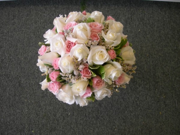 This gorgeous wedding bouquet features pink and white roses