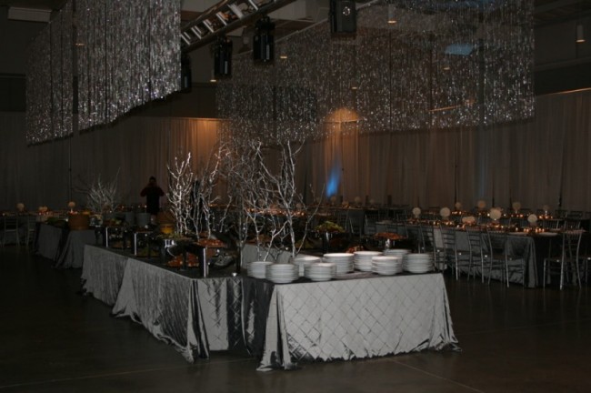 Patterned tablecloths in platinum and other silver accents make this an 