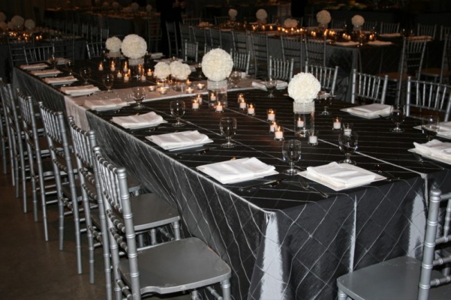 White carnation orbs form beautiful floral centerpieces for this