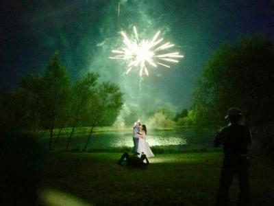 Fireworks Over Pond Illuminate Bridal Pair