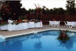 Excellent Use of Flowers - Poolside Wedding Reception