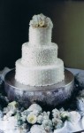 White Wedding Cake Topped With Beautiful Flowers