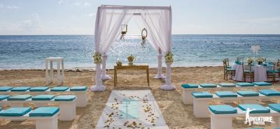 Exquisite teal themed beach wedding ceremony set up from Dreams in Riviera Maya, Mexico