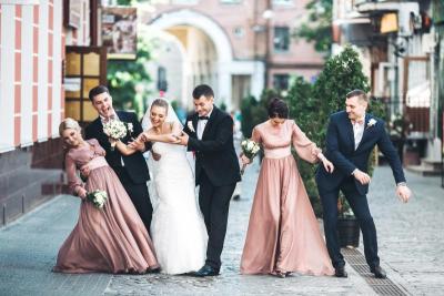Bridal party dancing in the street